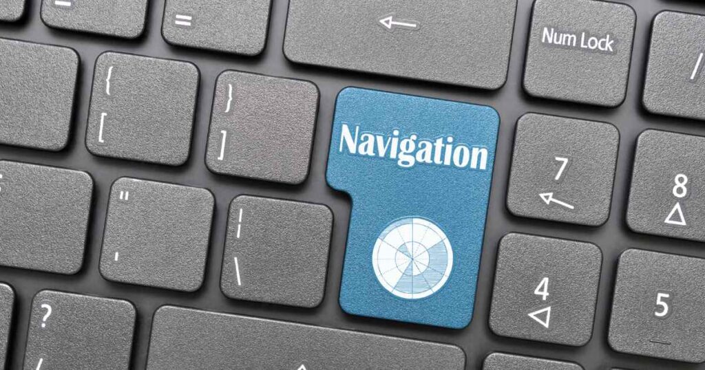 Nahaufnahme von einer Computer-Tastatur mit einem blauen Schalter und der Aufschrift Navigation